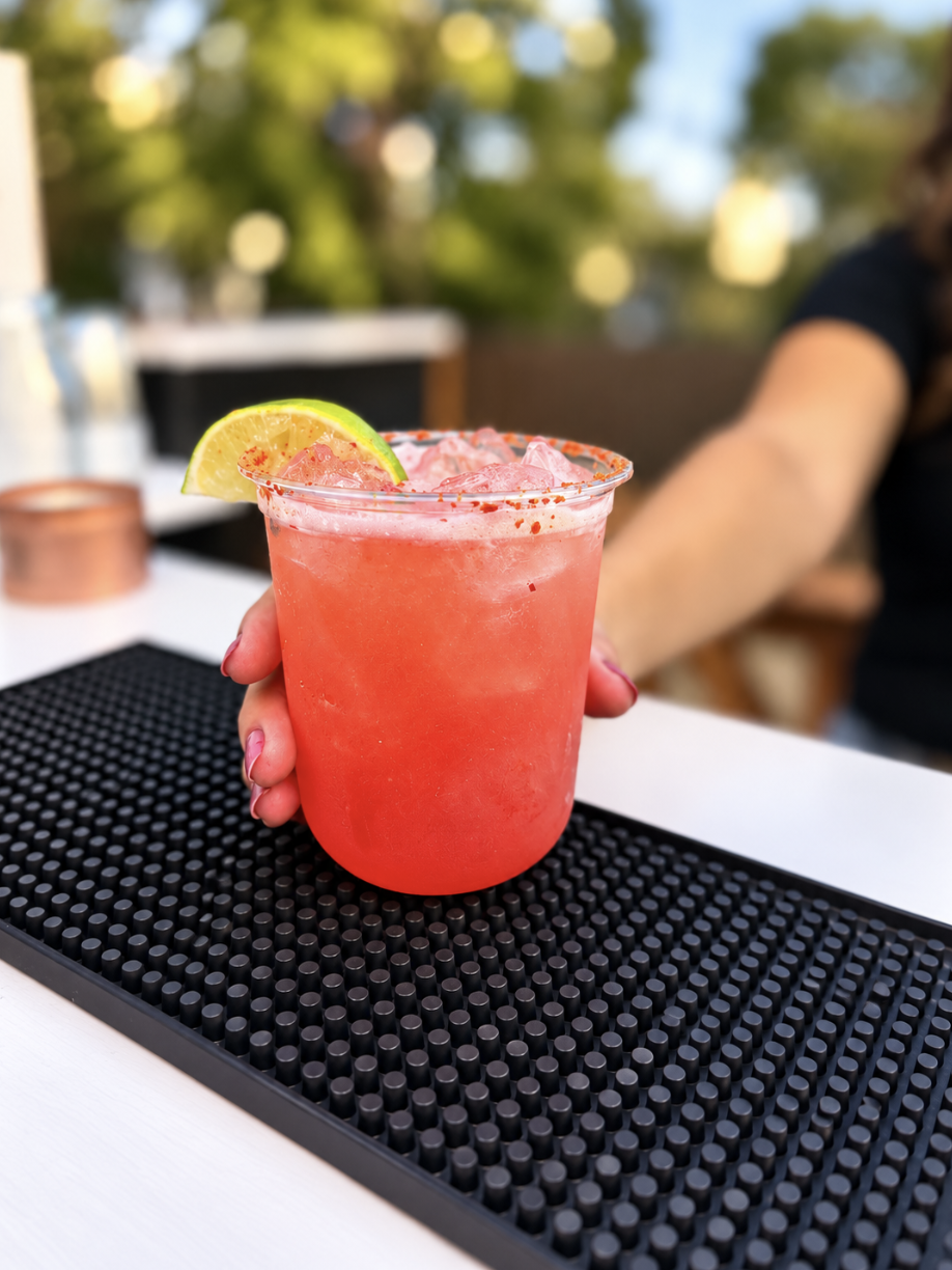 Watermelon margarita garnished with lime and chili salt